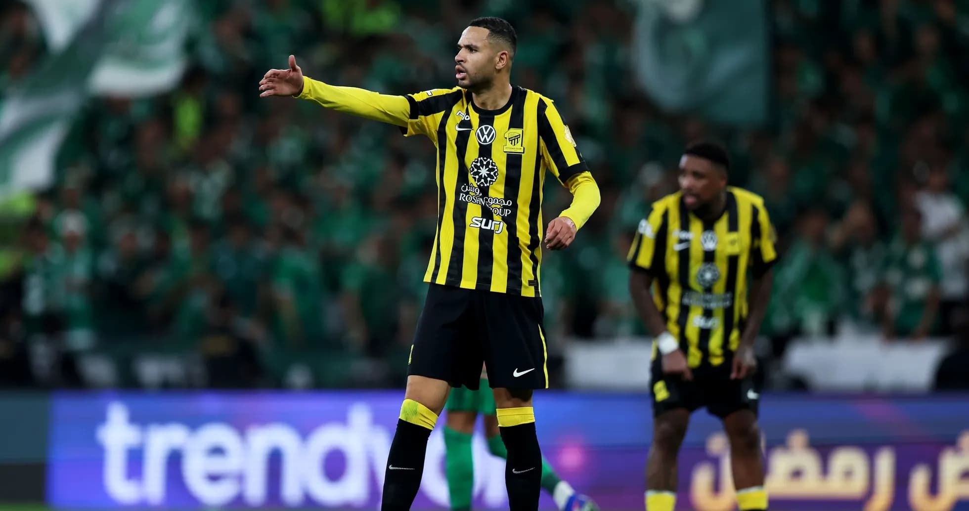 Player directing teammates during a football match