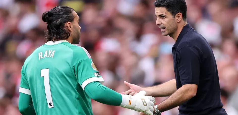 Goalkeeper Raya receiving instructions from the coach