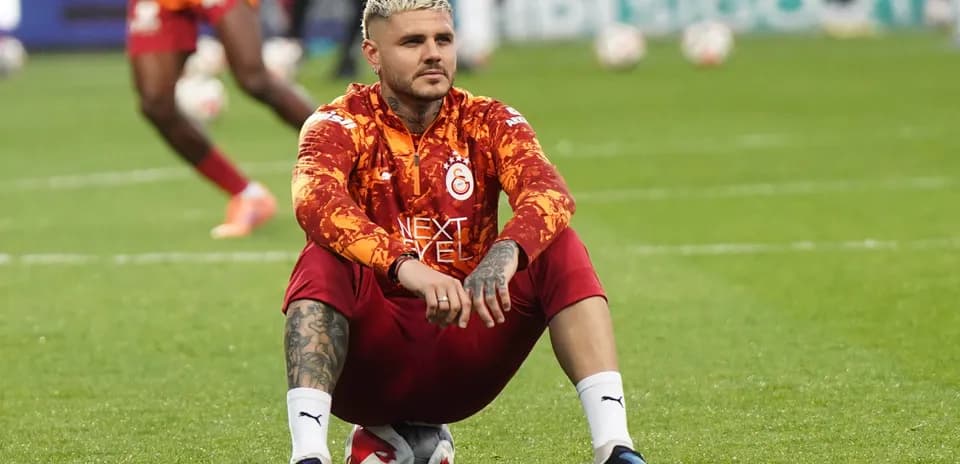 Player sitting on ball during warm-up session