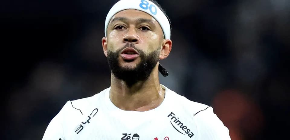 Player wearing white jersey with headband on field