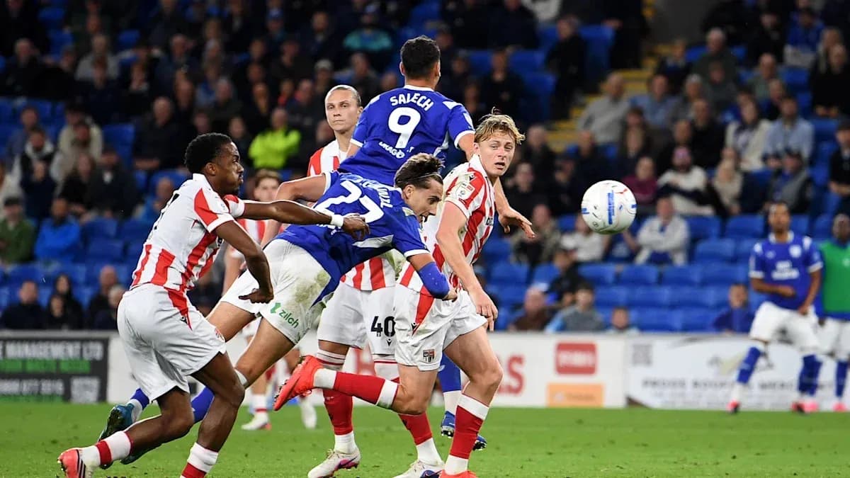 Player jumping to head the ball during match