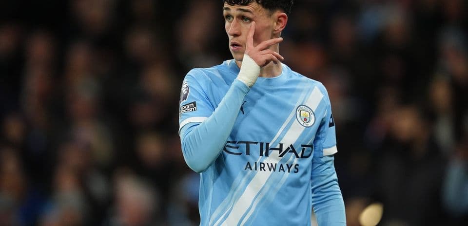 Player gesturing during match in light blue kit