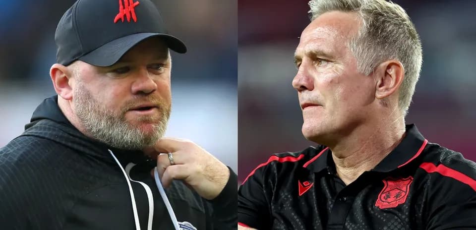 Two football managers during a match interaction