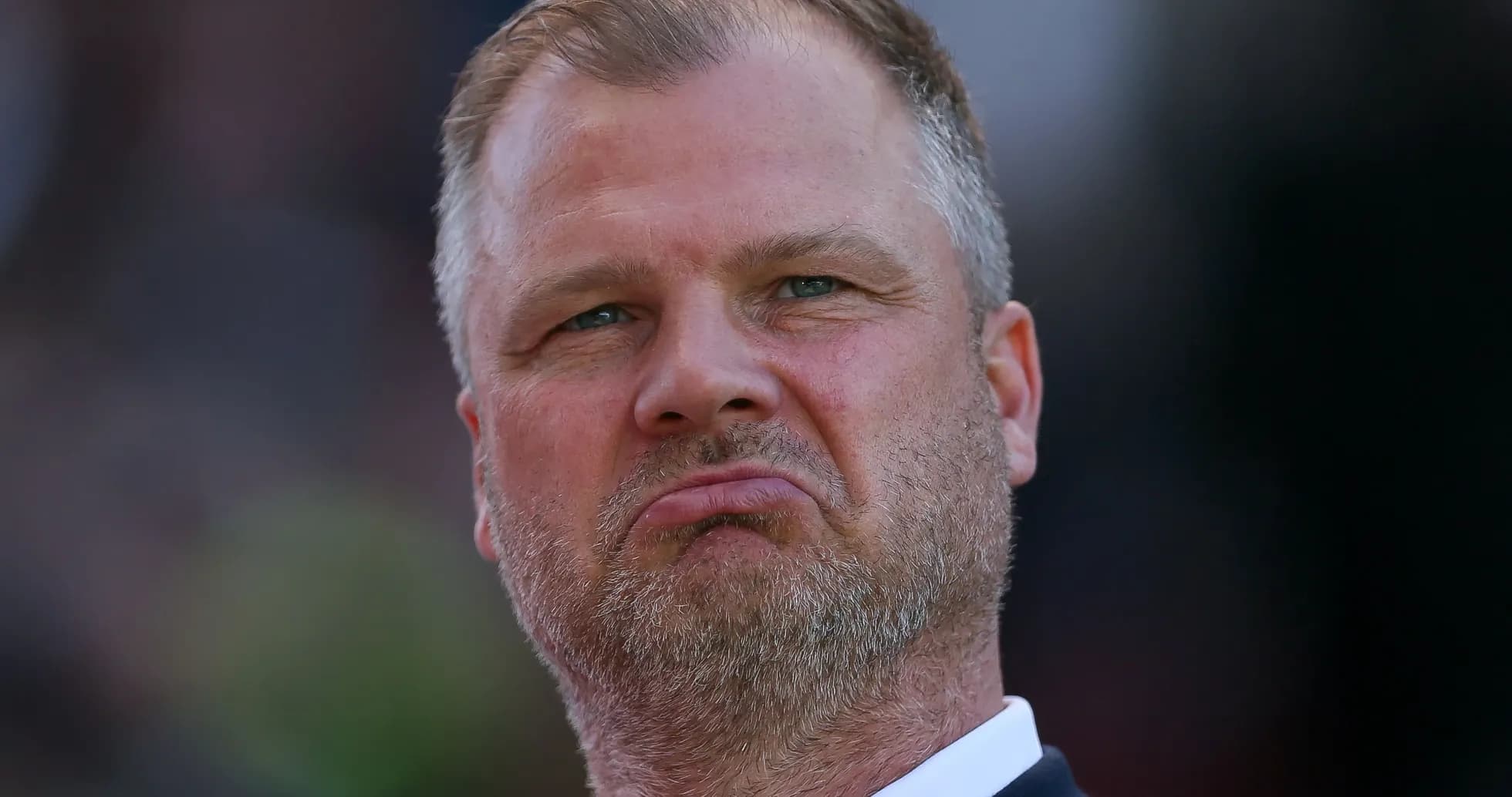 Man with serious expression during match