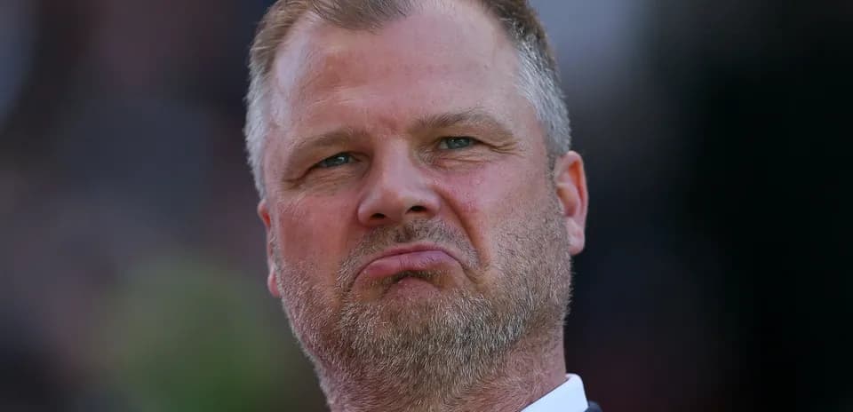 Man with serious expression during match