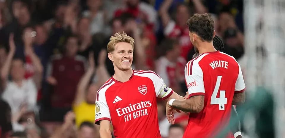 Arsenal players celebrating a goal during match