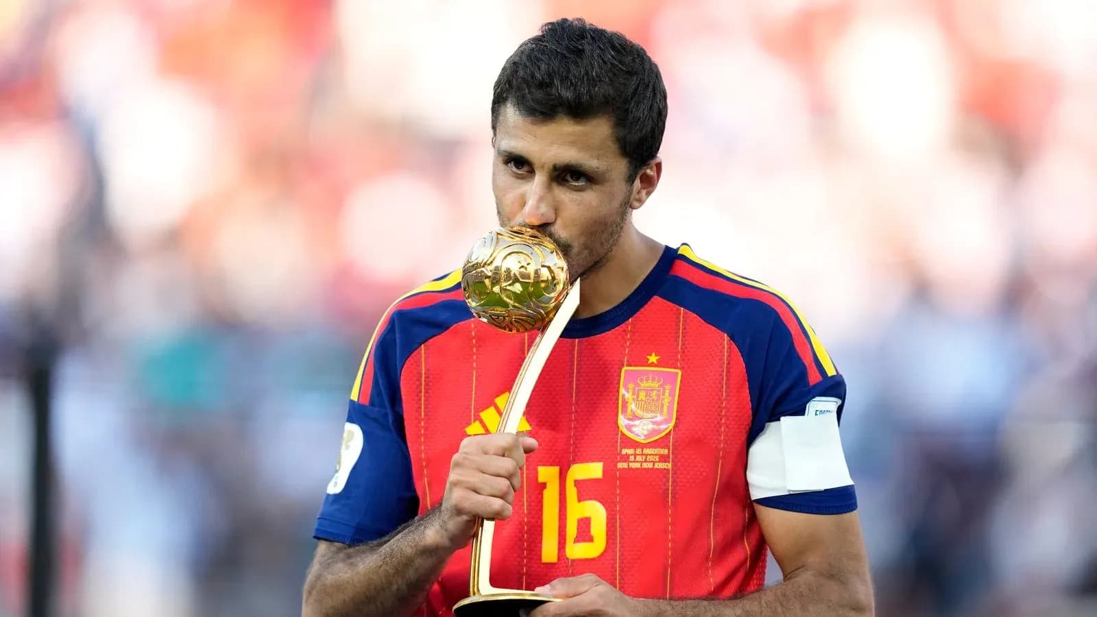 Player kissing trophy after winning tournament