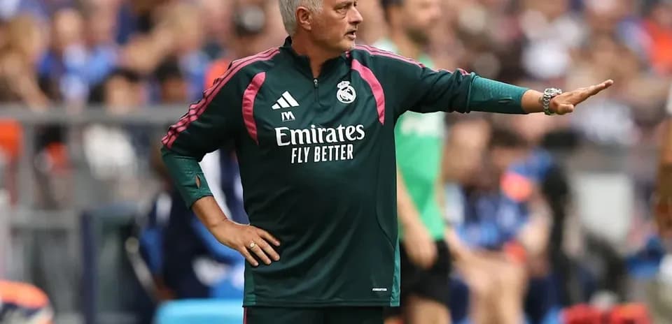 Coach giving instructions from the sideline