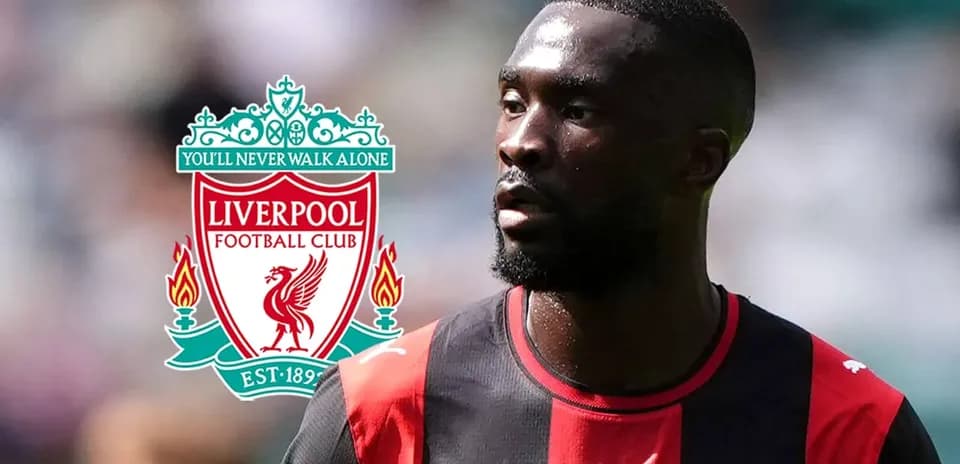 Player in black and red jersey with Liverpool logo