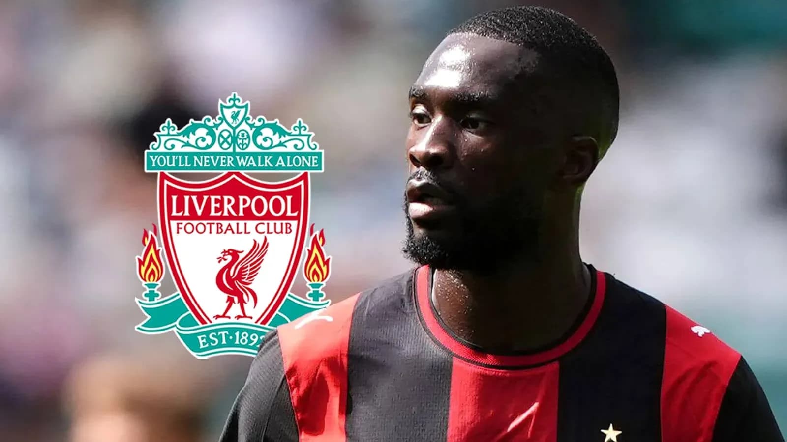 Player in black and red jersey with Liverpool logo