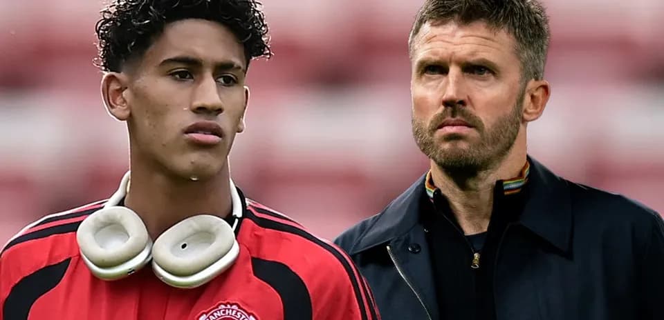 Young player in Manchester United kit with headphones