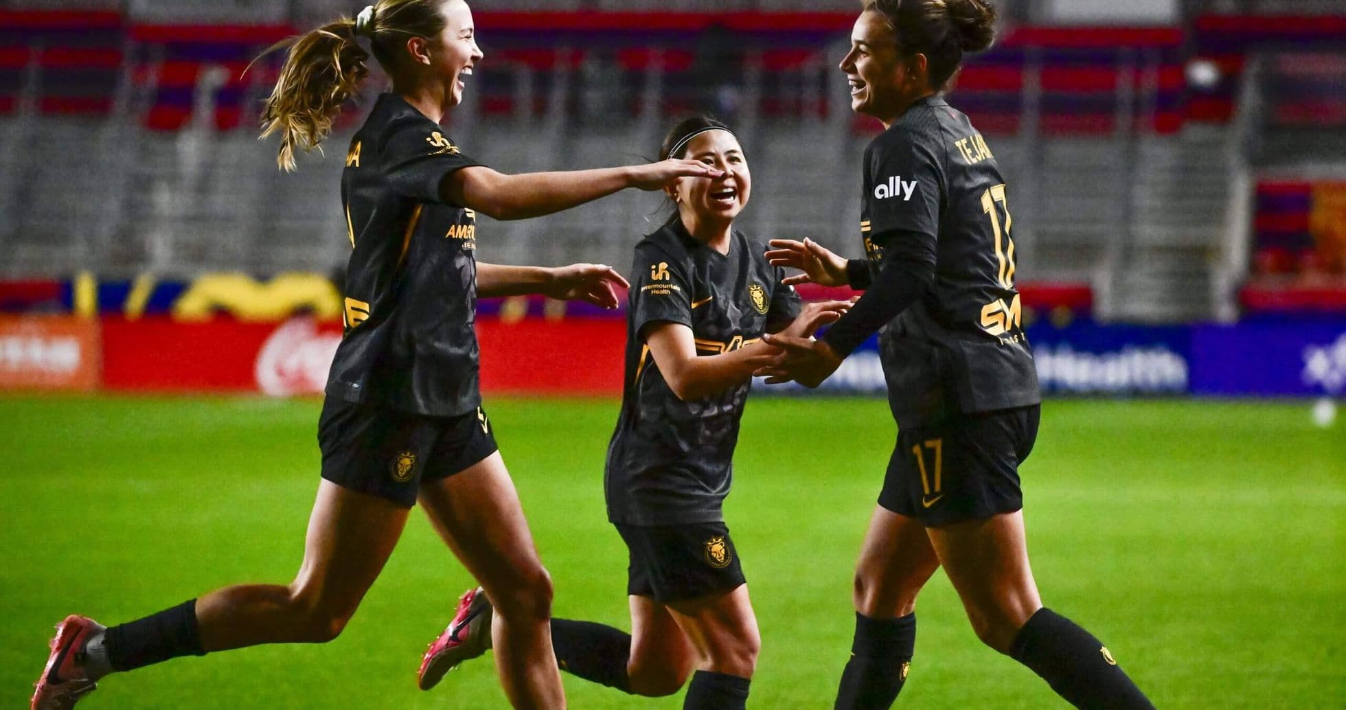 Players celebrating a goal during match