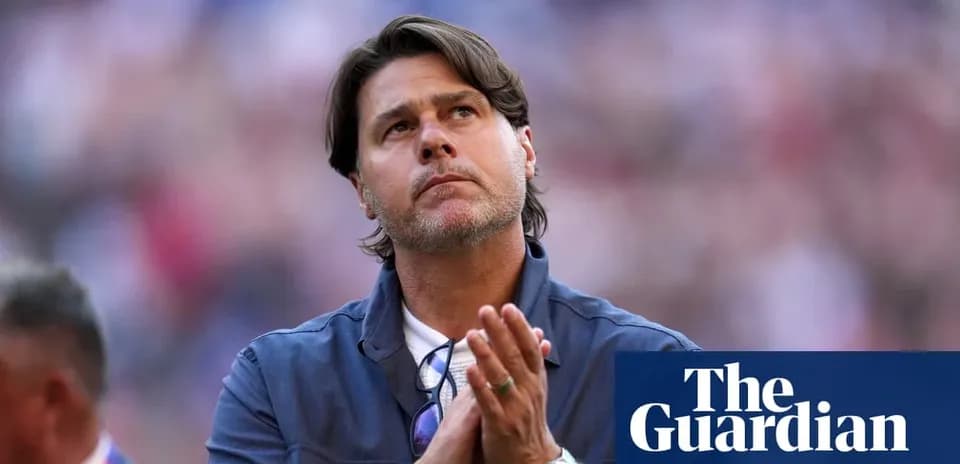 Coach looking up and clapping during match