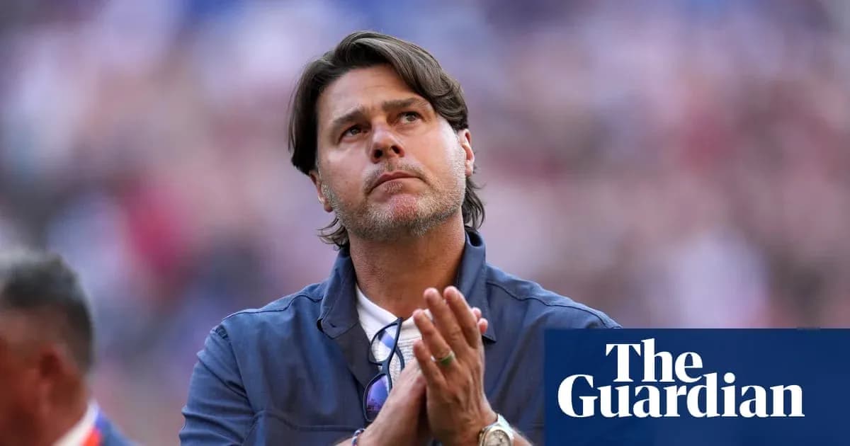 Coach looking up and clapping during match