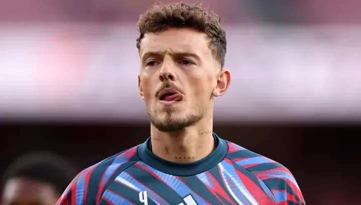 Goalkeeper in colorful kit during warm-up