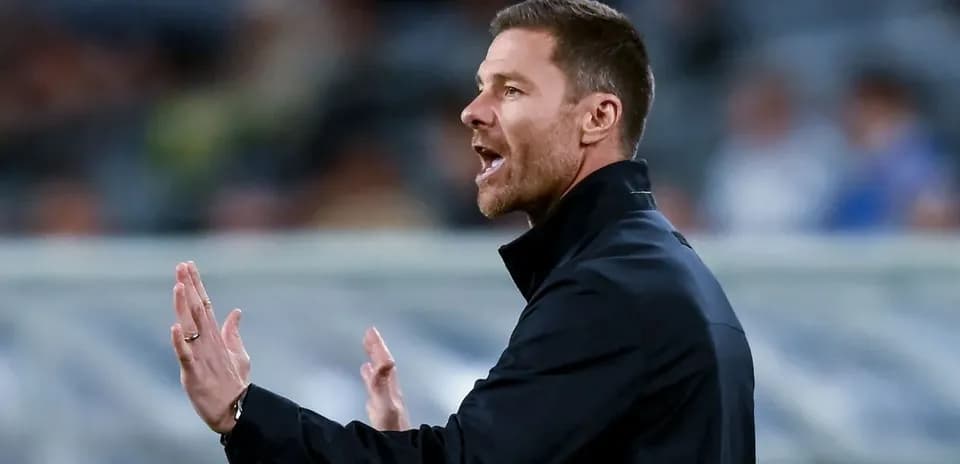 Coach gesturing during a match from the sidelines