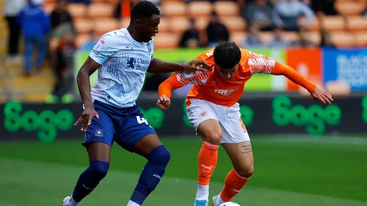 Two players battling for the ball during match