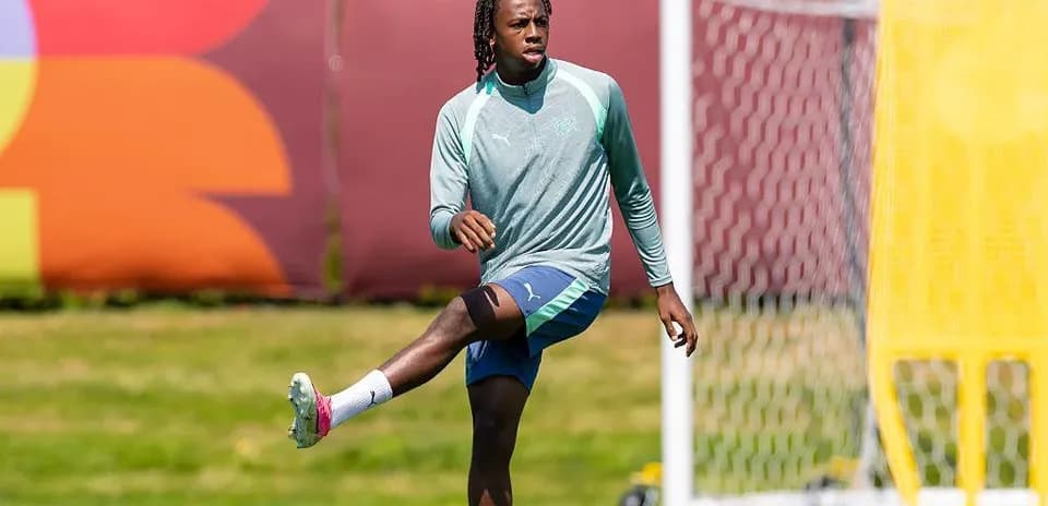 Player stretching during training session on field