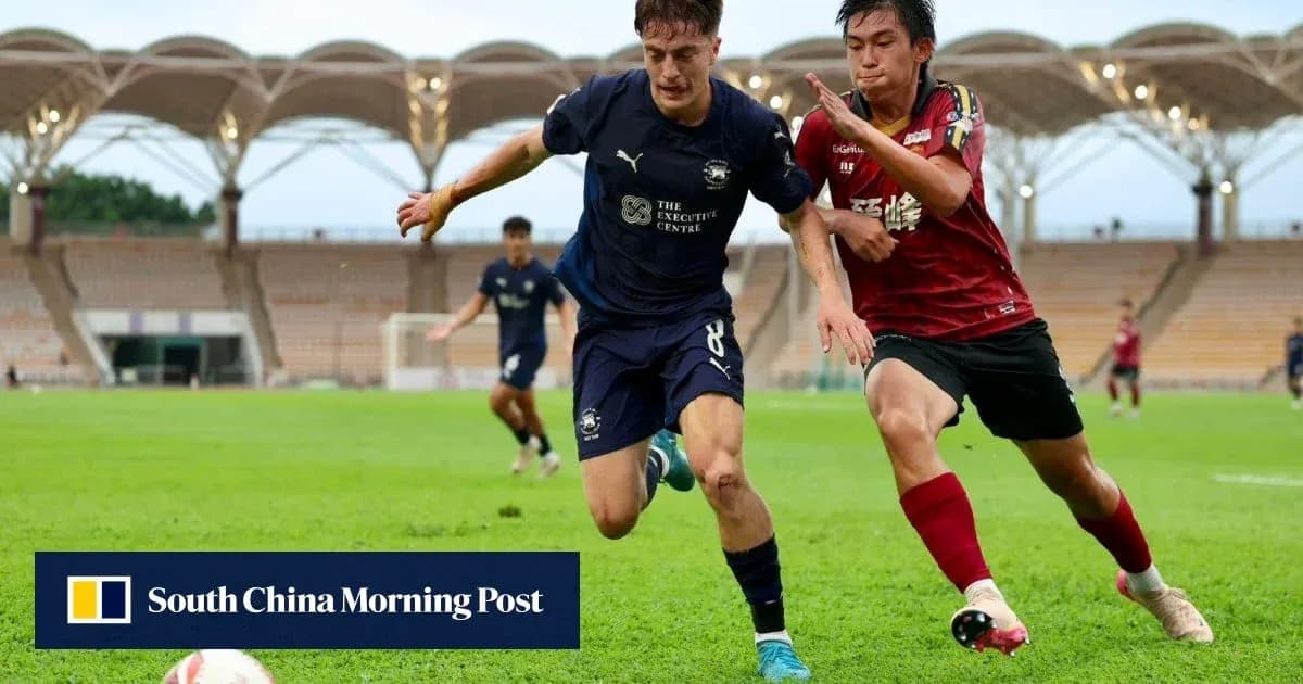 Player tackling opponent during soccer match on field
