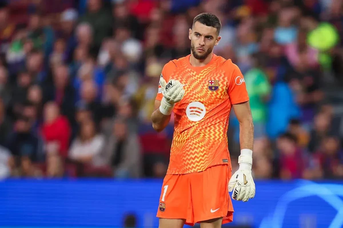 Goalkeeper in orange kit during match at stadium