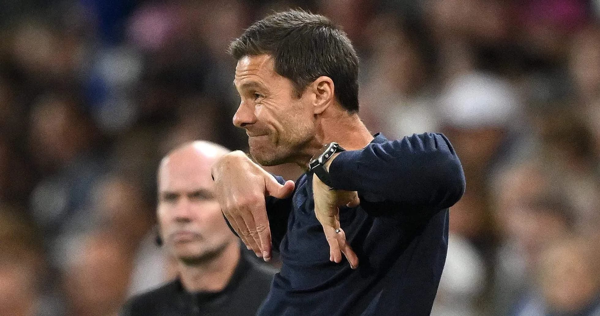 Coach gesturing during a match on the sidelines