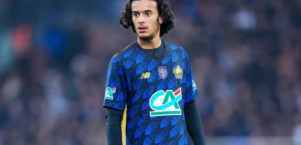 Player in blue jersey during a football match
