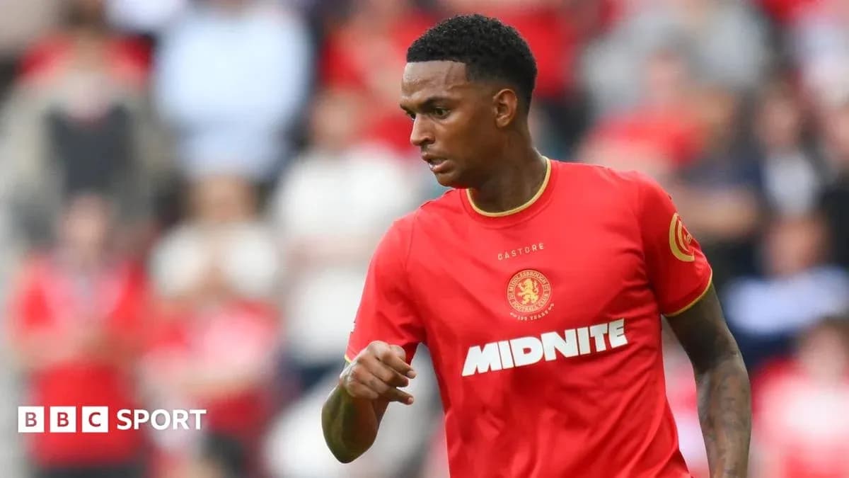 Player in red kit during a football match