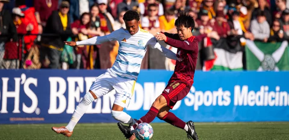 Players competing for the ball in USL match