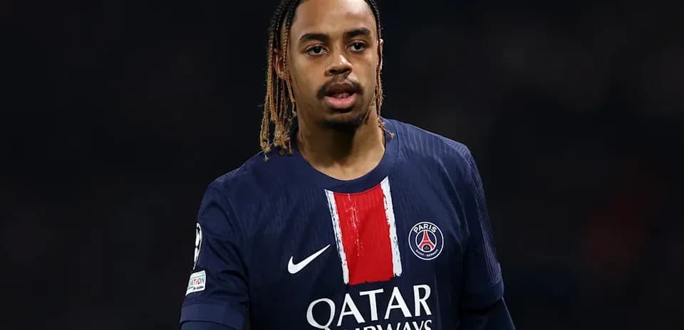 Football player wearing PSG jersey on the field