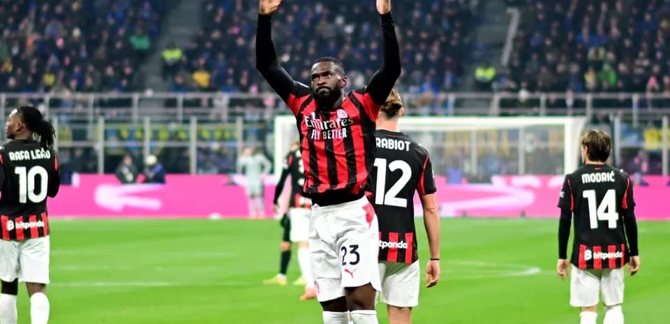 AC Milan players celebrating on the pitch