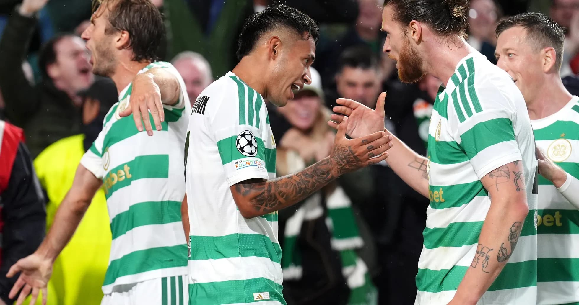Celtic players celebrating a goal during match