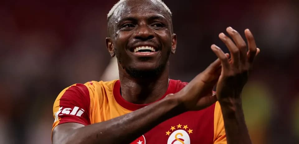 Player celebrating in Galatasaray jersey after match