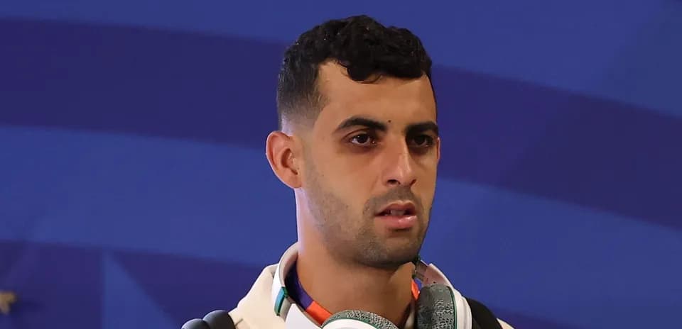 Player wearing headphones at an event