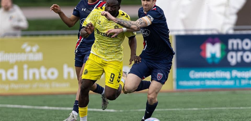 Players competing for the ball during match