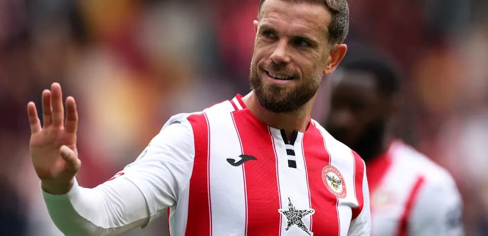 Brentford player waving during match celebration