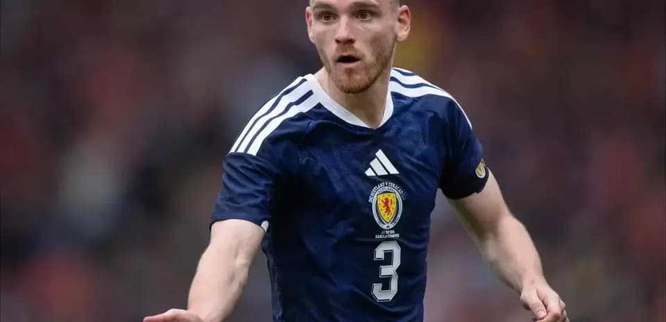 Scottish player gesturing during football match