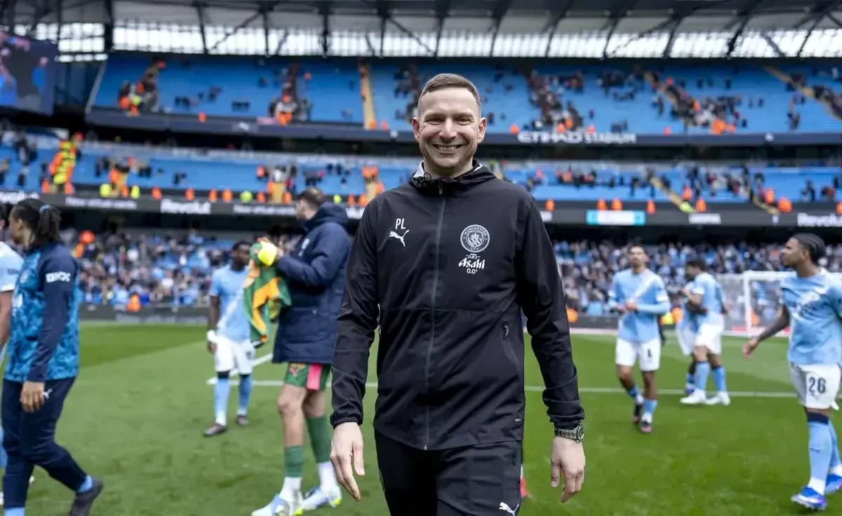Coach walking off the pitch at Etihad Stadium
