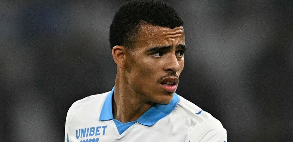 Player in white jersey looking towards the side