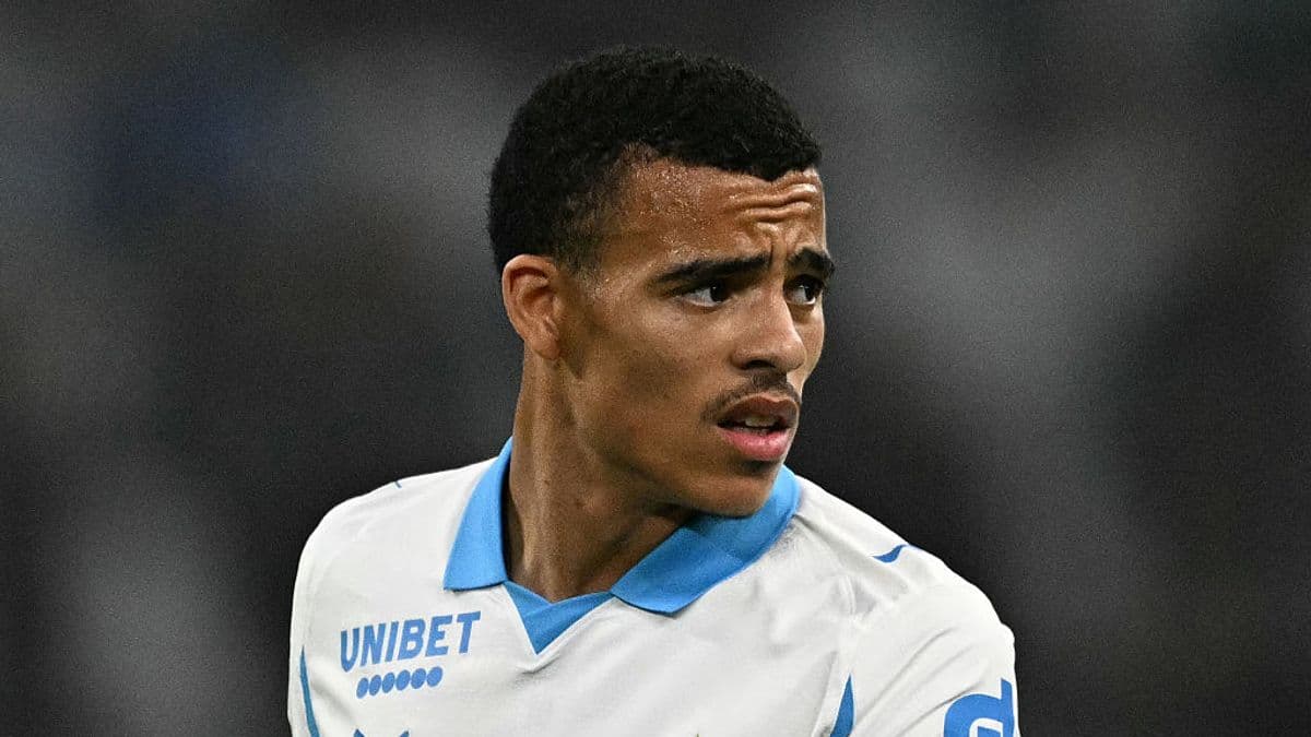 Player in white jersey looking towards the side