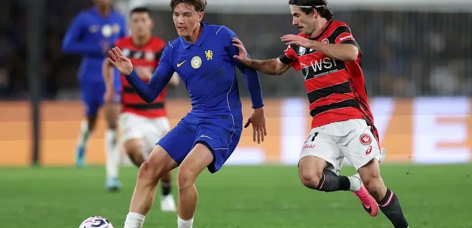 Player in blue evading opponent in red during match