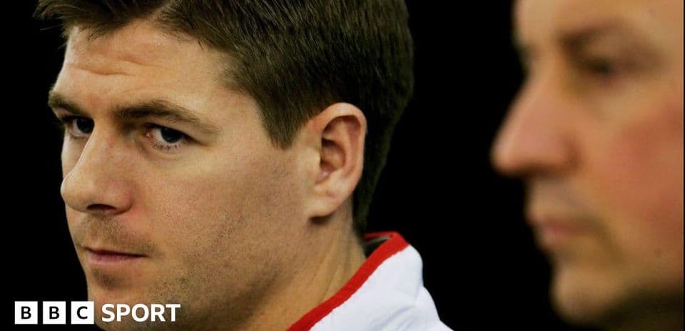 Two men during a press conference, one in focus