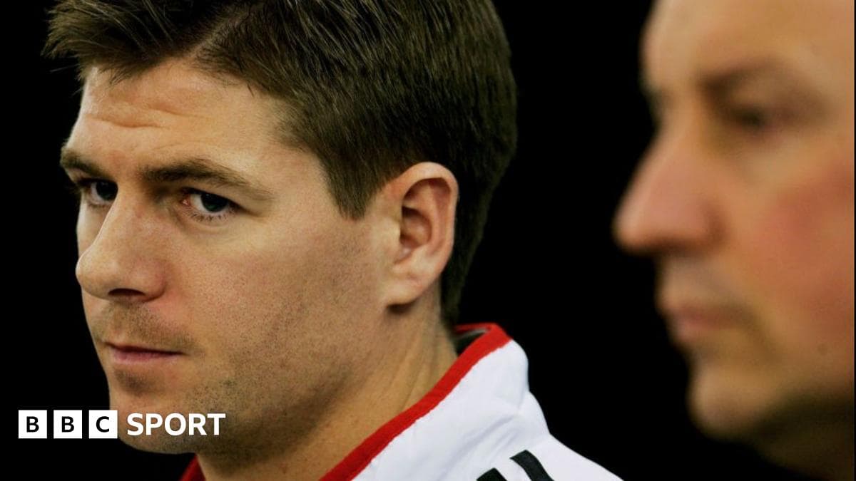 Two men during a press conference, one in focus