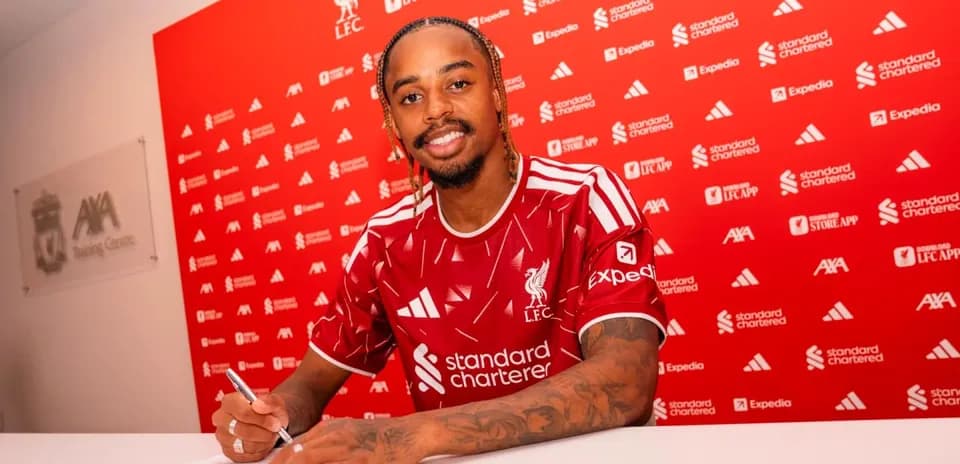 Player signing contract at Liverpool FC press conference
