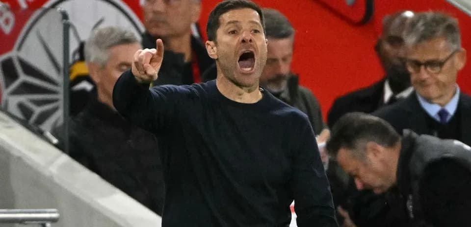 Coach giving instructions during a football match