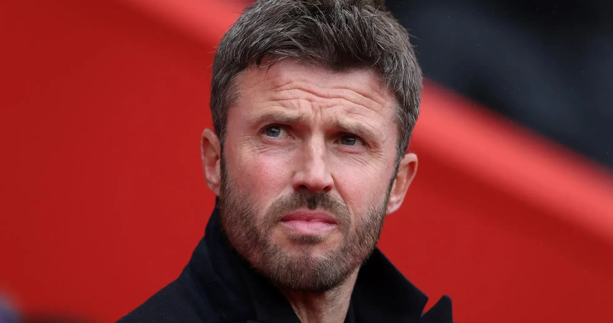 Coach observing the match from the sidelines