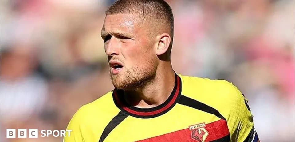 Watford player during match with focused expression