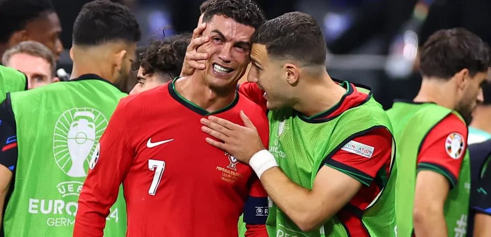 Cristiano Ronaldo and teammate celebrating on the field