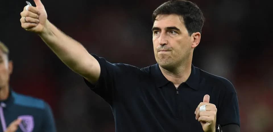 Coach giving thumbs up after match conclusion