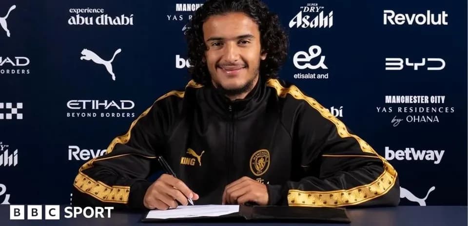 Player signing contract at Manchester City announcement