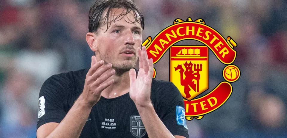 Player applauding with Manchester United logo in background